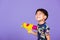 Thai kid funny hold toy water pistol and smiling