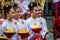 Thai ladies hold an offering in Chiang Rai Candle Festival of the Buddhist Lent period.