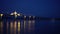 Thai Laos boarder bridge over mekong river beautiful refliection at night view with half light lit during pandemic