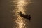 Thai and laos people riding long tail boat for catch fishing and reflection light surface water of Mekhong River and lighting of