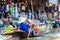 Thai locals sell food and souvenirs at famous Damnoen Saduak floating market, Thailand