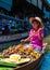 Thai locals sell food and souvenirs at famous Damnoen Saduak floating market, Thailand