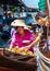 Thai locals sell food and souvenirs at famous Damnoen Saduak floating market, Thailand