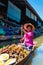 Thai locals sell food and souvenirs at famous Damnoen Saduak floating market, Thailand