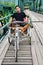 Thai Man sit at Riding tricycle on Bridge over Pai Rive of Mae Hong Son Thailand