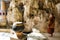 Thai monk people visit and respect praying buddha statue at Tham Phra Khao Chaison Caves temple