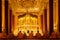 Thai monk pray for buddha at beautiful temple of Bangkok Thailand in back view