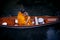 Thai monk sailing wood boat in canal for receiving food offering from pilgrim