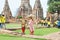 , Thai mother and her son in ancient Thi style clothing posting to camera with ancient buildings structure in Ayudhaya as