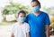 Thai mother and little girl wearing mask for protect coronavirus