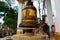 Thai old woman people praying and rite rotate and spin big bell