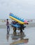 Thai people carrying rubber boat on the beach of Si Racha