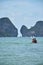 Thai people and foreign travelers rowing canoe kayak in sea for relax travel visit limestone isle mountain in ocean of andaman