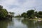 Thai people spinning pedal boats in pond at garden of Dusit Zoo or Khao Din Wana park with Ananta Samakhom Throne Hall