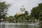 Thai people spinning pedal boats in pond at garden of Dusit Zoo or Khao Din Wana park with Ananta Samakhom Throne Hall