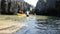 Thai people travelers paddle canoe travel Prasat Hin Pan Yod in Satun, Thailand