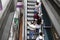 Thai people using an escalator to reach the Skytrain platform in Bangkok, Thailand