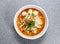 thai rice noodle in laksa soup with thai sausages and fish ball served in bowl isolated on grey background top view of hong kong