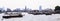 Thai riverside naval commuter traffic in Chao Phraya River with Wat Arun Temple of Dawn background, Bangkok, Thailand. Thailand