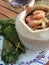 Thai shrimp and vegetables in coconut bowl.