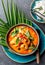 THAI SHRIMPS RED CURRY. Thailand Thai tradition red curry soup with shrimps prawns and coconut milk. Panaeng Curry in