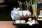 Thai spa composition treatments aroma therapy with candles and Plumeria flowers on wooden table