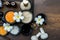 Thai spa composition treatments aroma therapy with candles and Plumeria flowers on wooden table close up.