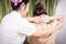 Thai Spa masseur is stretching women shoulder in Thai massage