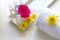 Thai Spa relax Treatments and massage with pink rose and yellow flower on wooden white. Healthy Concept