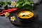 Thai spicy pumpkin and coconut milk soup with kaffir lime leaves , red chilli and galangal roots powder.