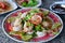 Thai Spicy salad with chicken, shrimp, fish and vegetables