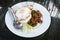 Thai stir-fried pork andfried egg and basil served with rice