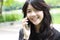 Thai student teen beautiful girl Answer the phone and smile