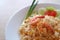 Thai style fried rice with shrimp or Khao Pad Goong on a white plate