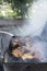 Thai style grilled pork Grill with smoke, street truck food shop