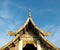 Thai Style Roof Top with Small Ring On Blue Sky