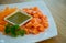 Thai style spicy salmon dice salad named `Yum` mixed vegetable and herb. Served with spicy sauce. Spicy Sashimi Salad Salmon . sal