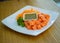 Thai style spicy salmon dice salad named `Yum` mixed vegetable and herb. Served with spicy sauce. Spicy Sashimi Salad Salmon . sal