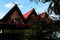 Thai style wooden pavilion with 3 gable roof by the pond