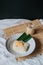Thai sweet sticky rice with durian,glutinous rice eat with coconut milk durian creamy sauce is a delicious sweet thai food on tabl