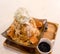 Thai tea shaved ice topped with whipped cream and white bread by