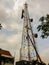 Thai Technicians Working On A Telecommunication Tower in Pattaya, Thailand