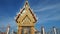 Thai temple soaring into blue sky