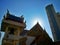 Thai temple under blue sky with sunrise on top of building