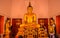 Thai temple. Wat Mongkol Nimit Temple Phuket, Thailand. Golden buddha interior.