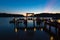 Thai terrace lounges with pergola at sunset on wooden pier in Ko