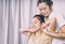 Thai Therapist is stretching woman shoulder and neck