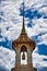 A Thai traditional bell tower belfry with detailed, mosaic artwork and gold colored design at Wat Phra Kaew Temple of the