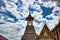 A Thai traditional bell tower belfry with detailed, mosaic artwork and gold colored design at Wat Phra Kaew Temple of the