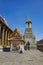 A Thai traditional bell tower belfry with detailed, mosaic artwork and gold colored design at Wat Phra Kaew Temple of the